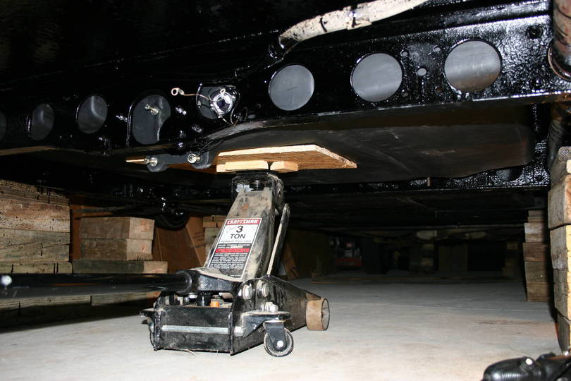 Use of Floor Jack to Lift Black Tank