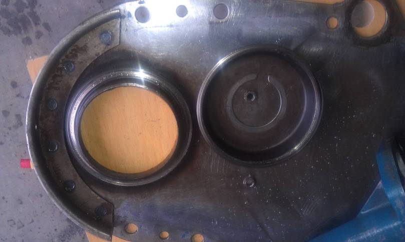 Oil slinger, timing cover