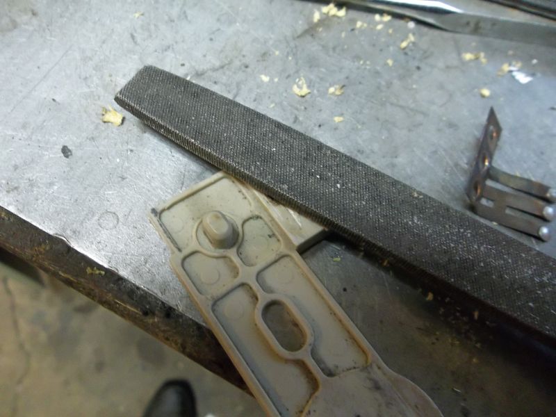fileing the plastic upset on the lever