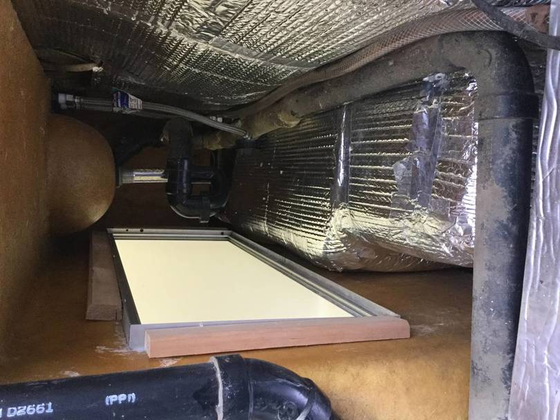 New storage area under bathroom counter