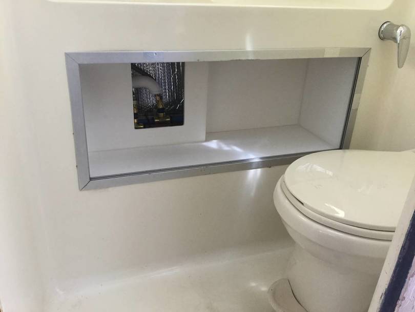 New storage area under bathroom counter