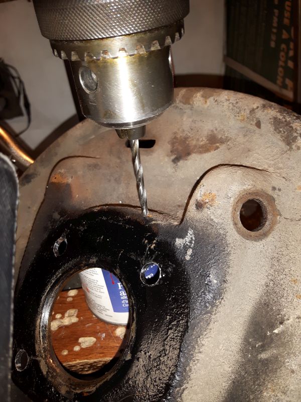 Pilot holes drilled into the backing plate