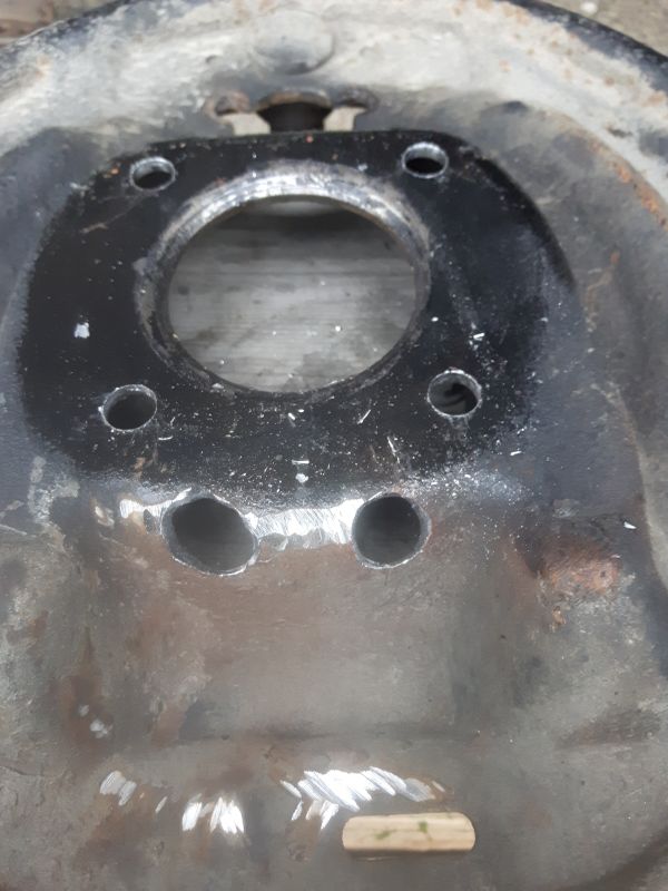 Final holes in backing plate