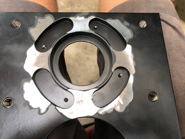 Clearanced back side of caliper plate