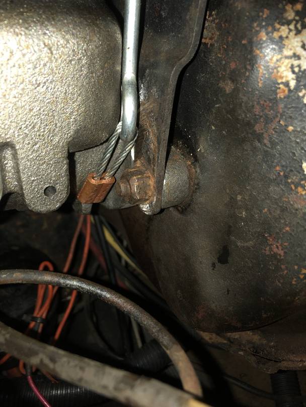 Bracket mounts in front of the MC ears on early coaches.