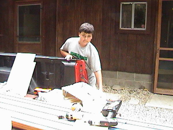 Joe helps with GMC Pinewood Derby track